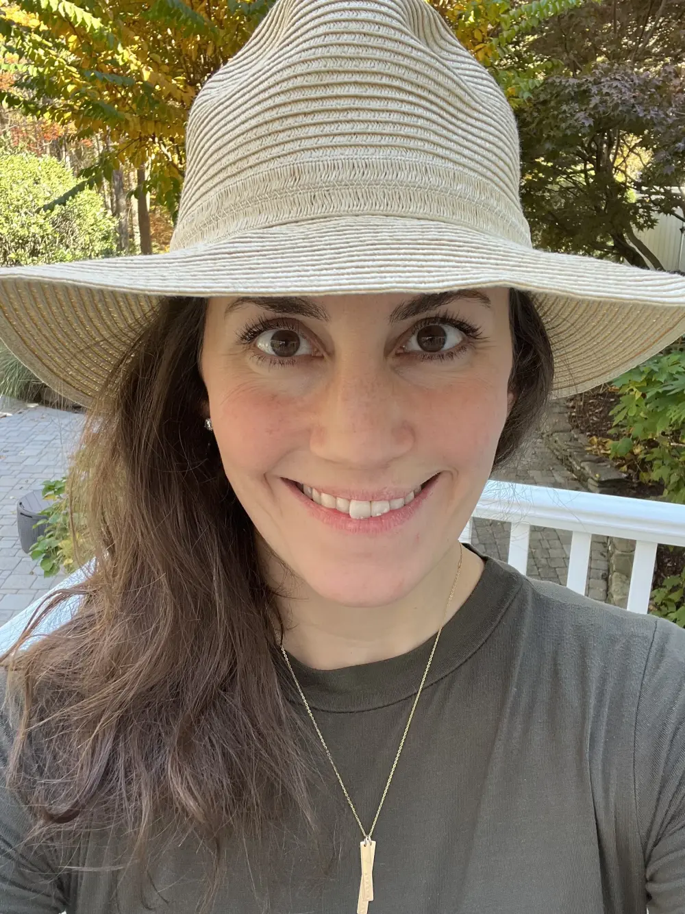 Meg in her sun hat, smiling
